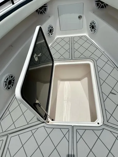  Yacht Photos Pics Open storage compartment on 2021 Streamline 35CC boat deck with geometric pattern.