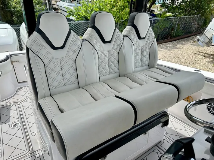  Yacht Photos Pics Luxurious seating on 2021 Streamline 35CC boat, featuring elegant white upholstery and modern design.