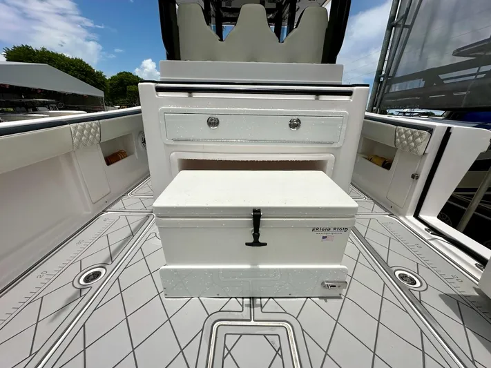  Yacht Photos Pics 2021 Streamline 35CC boat interior with storage and seating, featuring a Frigid Rigid cooler.