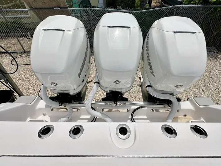  Yacht Photos Pics Three Mercury outboard engines on a 2021 Streamline 35CC boat, viewed from above.
