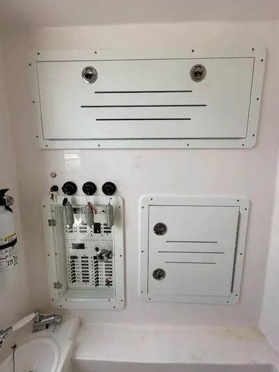 Yacht Photos Pics Control panel and storage compartments in a 2021 Streamline 35CC boat interior.
