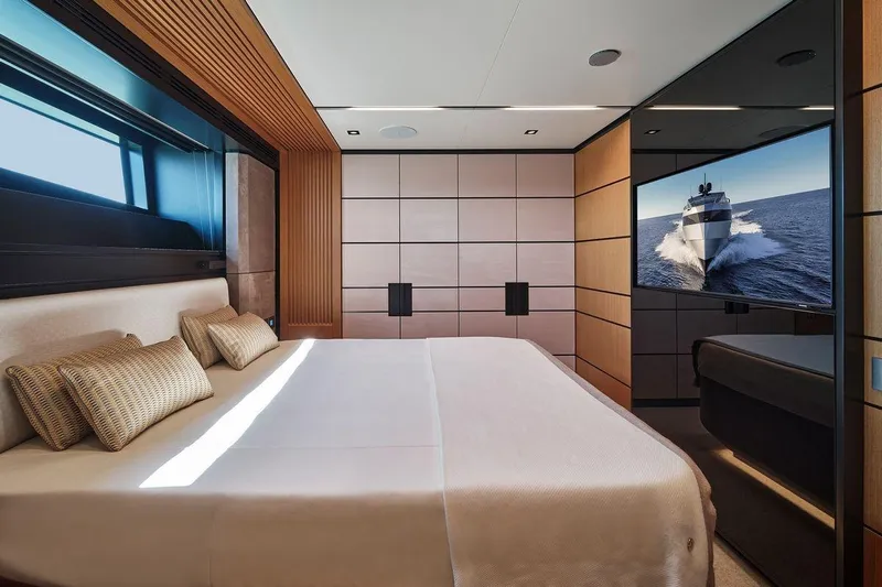 Carat Yacht Photos Pics Luxurious bedroom interior of 2024 Wally WallyWhy200 yacht with modern design and large window.