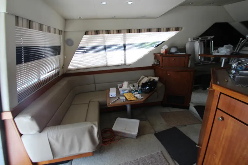  Yacht Photos Pics Interior of 1996 Bayliner 3988 Command Bridge Motoryacht with seating and table.