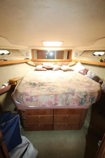  Yacht Photos Pics Cozy bedroom in 1996 Bayliner 3988 Command Bridge Motoryacht with storage drawers.