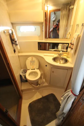  Yacht Photos Pics Bathroom interior of 1996 Bayliner 3988 Command Bridge Motoryacht, featuring sink and toilet.