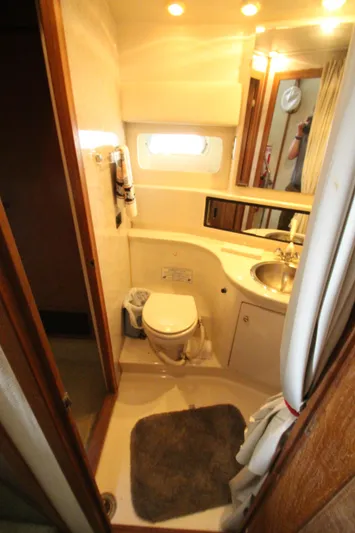  Yacht Photos Pics Bathroom interior of 1996 Bayliner 3988 Command Bridge Motoryacht with sink and toilet.