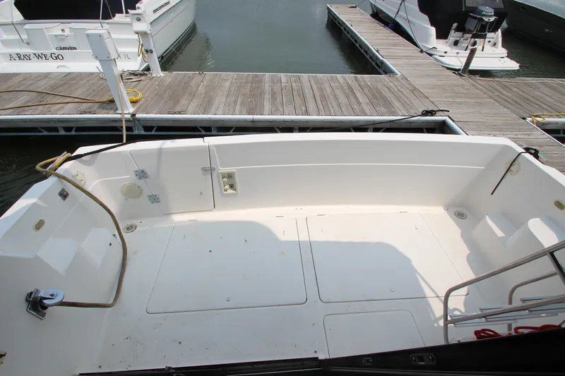  Yacht Photos Pics 1996 Bayliner 3988 Command Bridge Motoryacht docked, showing spacious deck area.