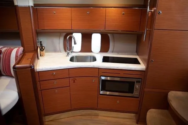 Gazelle Yacht Photos Pics Luxurious 2014 Zeelander Z44 yacht kitchen with modern appliances and elegant wood cabinetry.