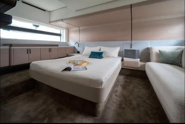 Pam Yacht Photos Pics Luxurious bedroom interior of 2023 Azimut Fly 53 yacht with modern design and cozy bedding.