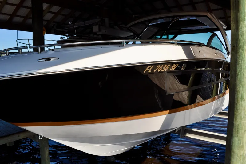  Yacht Photos Pics 2019 Four Winns H350 OB boat docked under a shelter.