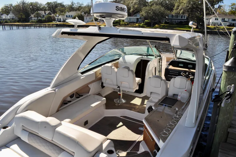  Yacht Photos Pics 2019 Four Winns H350 OB boat docked, featuring spacious seating and modern amenities.