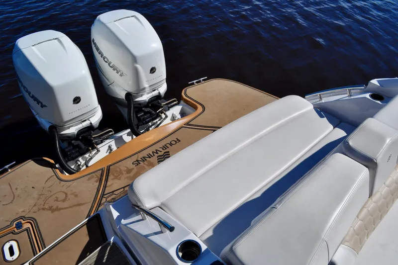  Yacht Photos Pics 2019 Four Winns H350 OB boat with twin Mercury outboard engines on a sunny day.