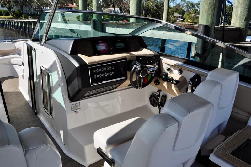  Yacht Photos Pics 2019 Four Winns H350 OB boat interior with modern dashboard and comfortable seating.