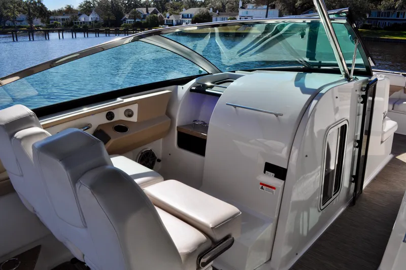  Yacht Photos Pics 2019 Four Winns H350 OB boat interior with helm, seating, and waterfront view.