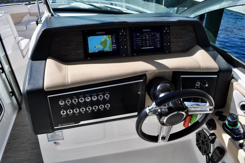 Yacht Photos Pics 2019 Four Winns H350 OB boat dashboard with steering wheel and navigation displays.