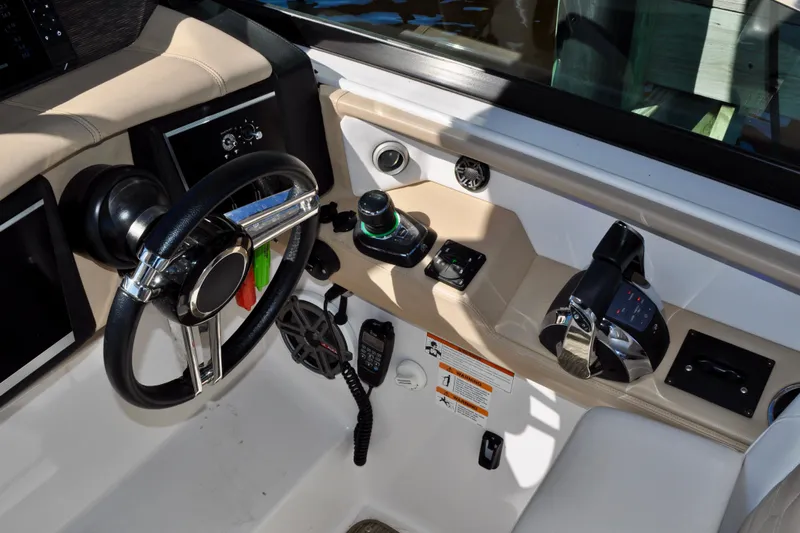  Yacht Photos Pics Cockpit of 2019 Four Winns H350 OB boat with steering wheel and controls.