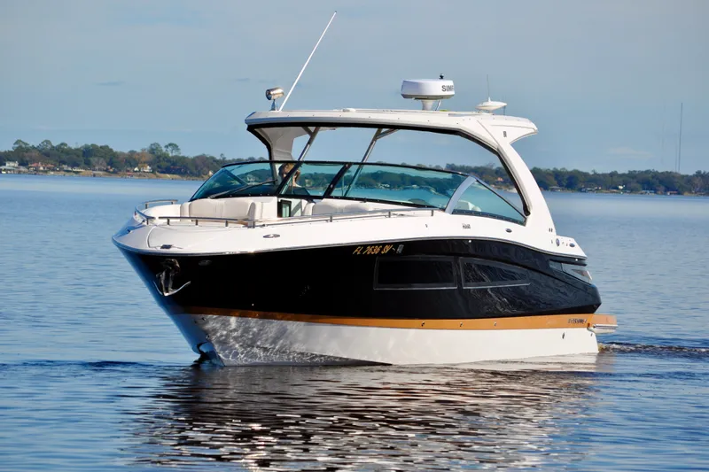  Yacht Photos Pics 2019 Four Winns H350 OB boat cruising on calm water.