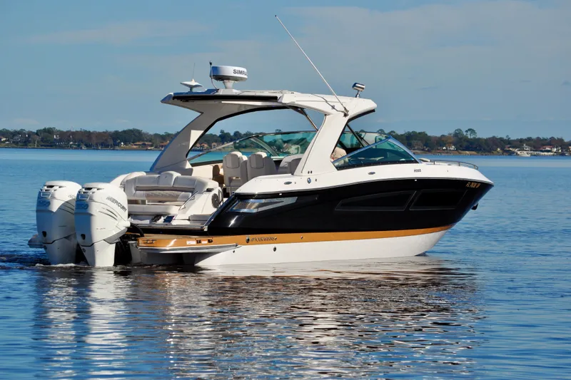  Yacht Photos Pics 2019 Four Winns H350 OB boat cruising on a calm lake.