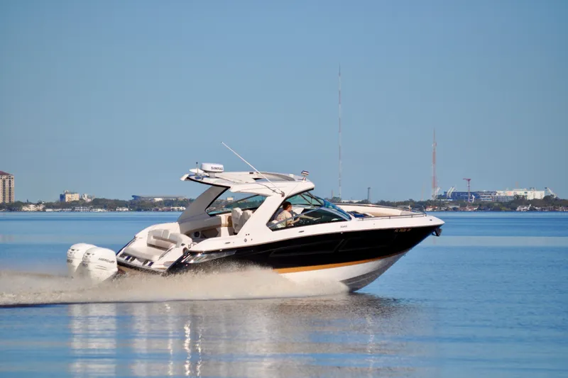  Yacht Photos Pics 2019 Four Winns H350 OB boat cruising on calm water.