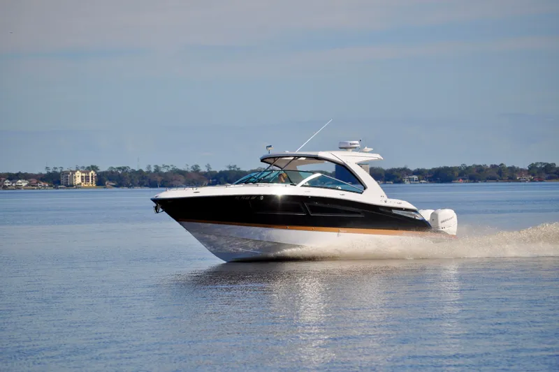  Yacht Photos Pics 2019 Four Winns H350 OB cruising on a calm lake.