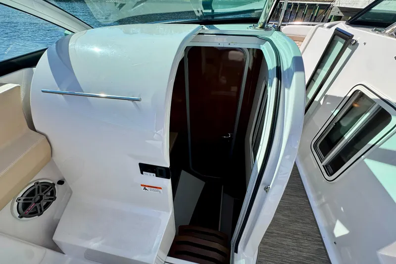  Yacht Photos Pics 2019 Four Winns H350 OB boat cabin entrance with sleek design and modern features.