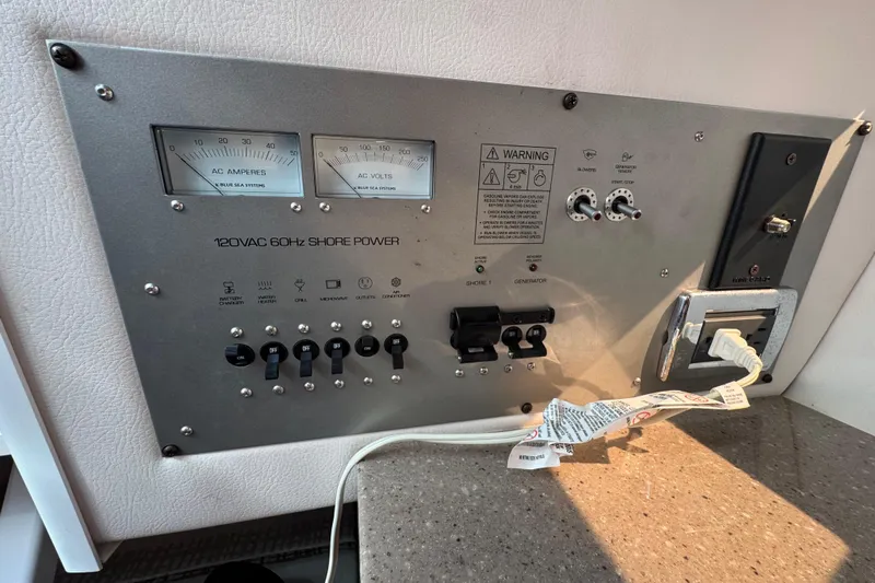  Yacht Photos Pics Control panel of a 2019 Four Winns H350 OB boat, featuring AC power indicators.