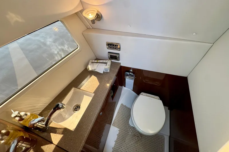  Yacht Photos Pics Luxurious 2019 Four Winns H350 OB boat bathroom with sink and toilet.