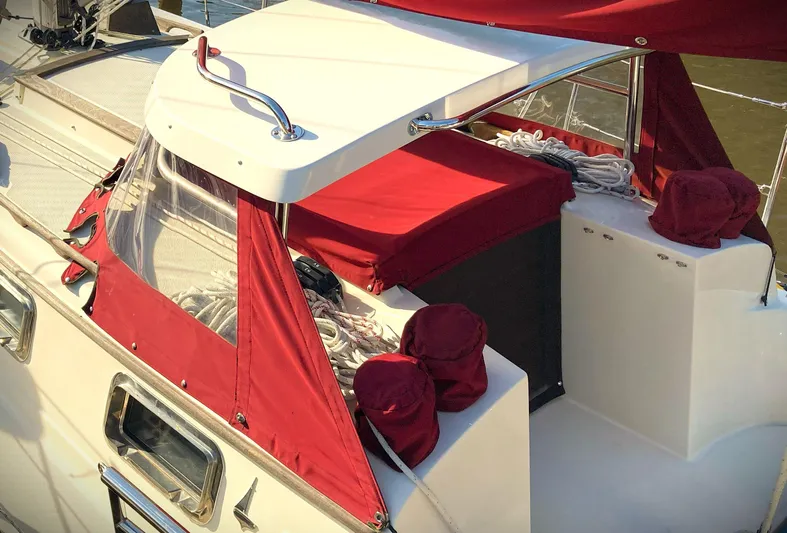 Last Dance Yacht Photos Pics 2019 Pacific Seacraft 31 sailboat with red canvas covers and sleek design.
