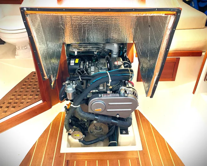 Last Dance Yacht Photos Pics Engine compartment of 2019 Pacific Seacraft 31 sailboat, showcasing detailed mechanical components.