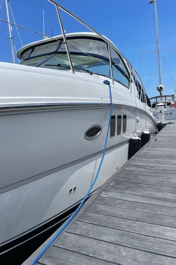  Yacht Photos Pics 2011 Sea Ray 390 Sundancer yacht docked at marina under clear blue sky.