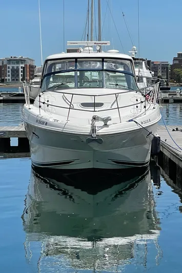  Yacht Photos Pics 2011 Sea Ray 390 Sundancer yacht docked in a marina, reflecting on calm water.