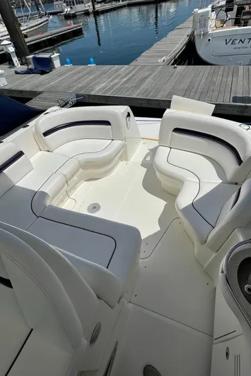  Yacht Photos Pics 2011 Sea Ray 390 Sundancer boat with spacious white seating area at a marina.