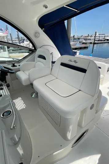  Yacht Photos Pics 2011 Sea Ray 390 Sundancer cockpit with white seating, marina view in background.