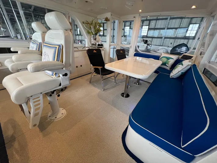 Bucephulas Yacht Photos Pics Luxurious interior of a 2012 Hampton Motoryacht with plush seating and elegant decor.
