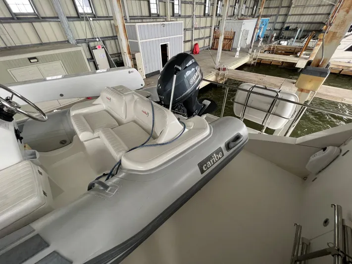 Bucephulas Yacht Photos Pics 2012 Hampton Motoryacht with Caribe tender in marina storage.