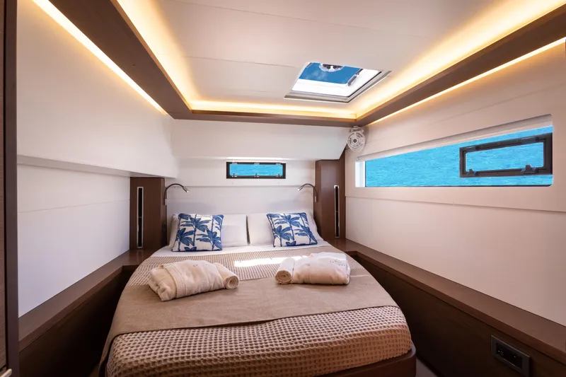 Twenty Cent Yacht Photos Pics Luxurious cabin interior of 2021 Lagoon 46 yacht with modern lighting and ocean view.