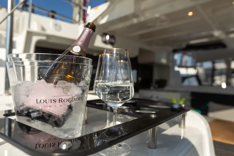 Twenty Cent Yacht Photos Pics Champagne and glass on Lagoon 46 yacht, 2021 model, luxury sailing experience.