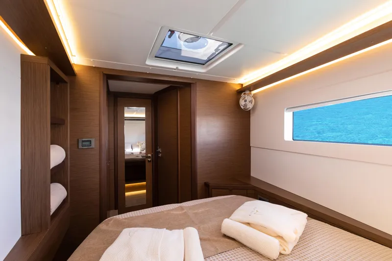 Twenty Cent Yacht Photos Pics Luxurious interior of 2021 Lagoon 46 yacht cabin with ocean view.
