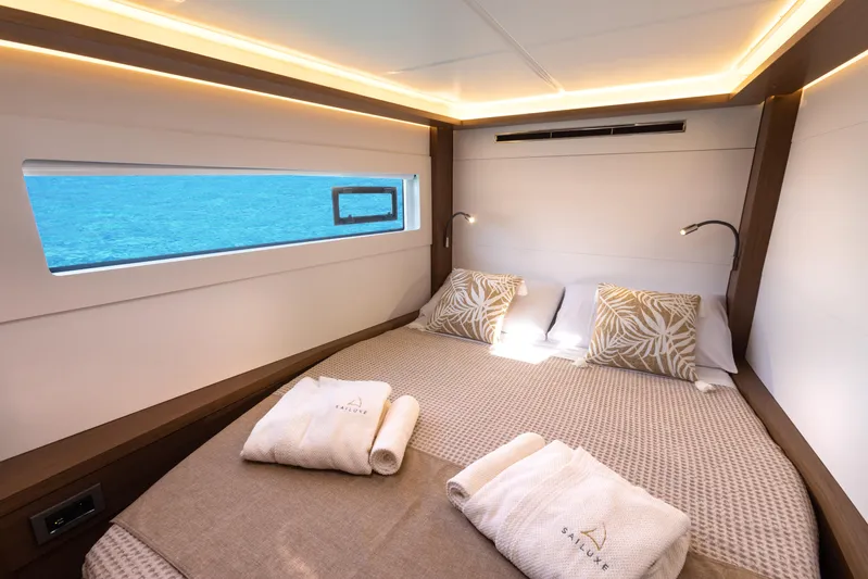 Twenty Cent Yacht Photos Pics Luxurious cabin interior of 2021 Lagoon 46 yacht with ocean view window.