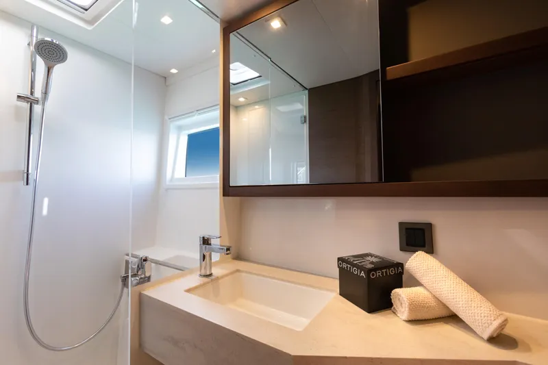 Twenty Cent Yacht Photos Pics Modern bathroom interior of 2021 Lagoon 46 yacht with sleek fixtures and natural light.