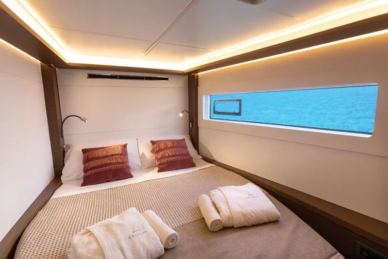 Twenty Cent Yacht Photos Pics Luxurious cabin interior of 2021 Lagoon 46 yacht with ocean view window.