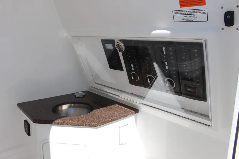  Yacht Photos Pics 2017 Buddy Davis 34 Center Console interior with control panel and sink.