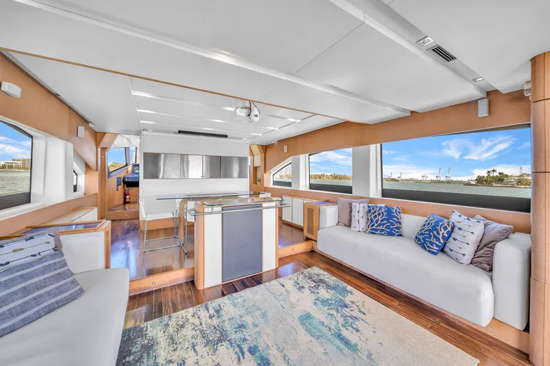 Therapy Yacht Photos Pics Luxurious interior of 2008 Aicon 75 Flybridge yacht with modern decor and panoramic windows.