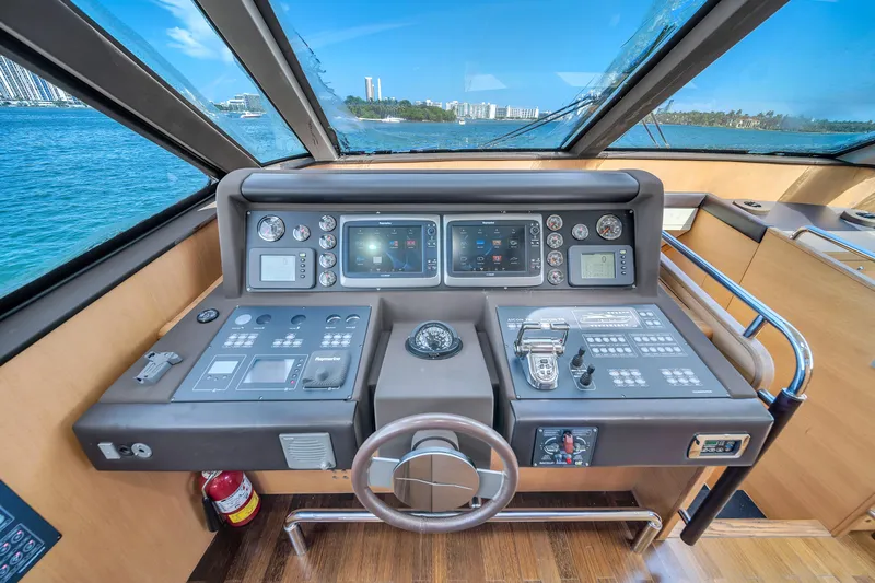 Therapy Yacht Photos Pics Aicon 75 Flybridge 2008 yacht helm with navigation controls and panoramic view.