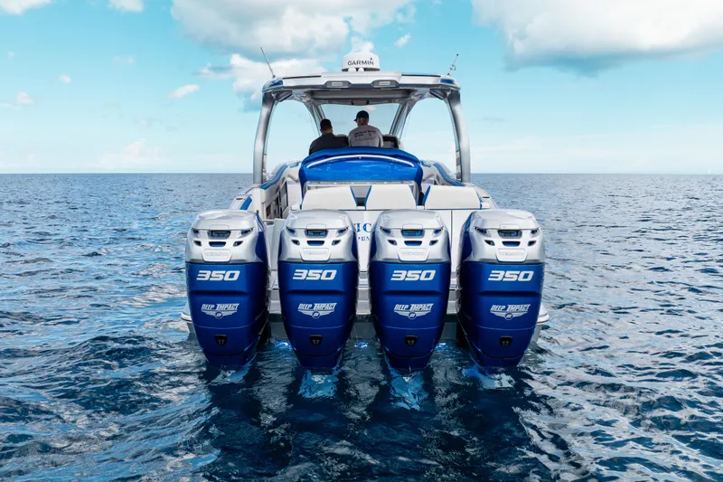  Yacht Photos Pics 2019 Deep Impact 399 Sport boat with four powerful engines on open water.