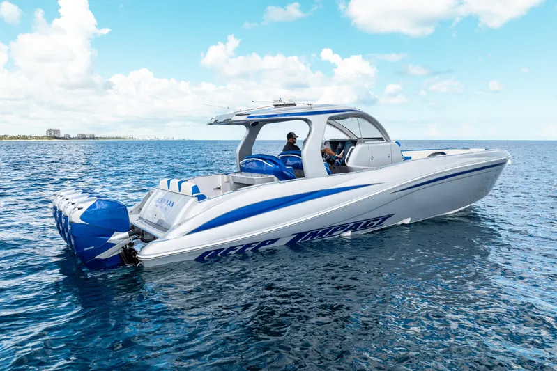  Yacht Photos Pics 2019 Deep Impact 399 Sport boat cruising on open water under a clear sky.