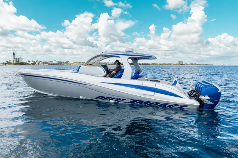  Yacht Photos Pics 2019 Deep Impact 399 Sport boat on open water under a blue sky.