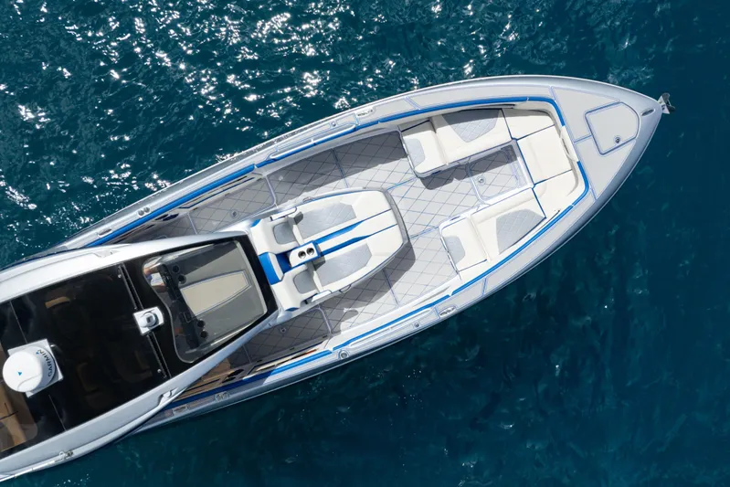  Yacht Photos Pics Aerial view of 2019 Deep Impact 399 Sport boat on blue ocean water.