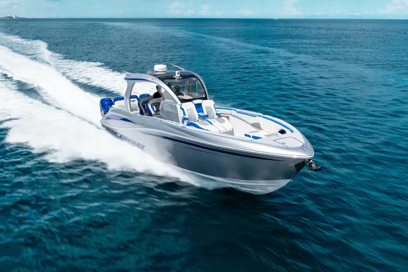  Yacht Photos Pics 2019 Deep Impact 399 Sport boat cruising on open blue water.