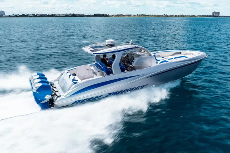  Yacht Photos Pics 2019 Deep Impact 399 Sport boat cruising on open water, showcasing sleek design and powerful engines.